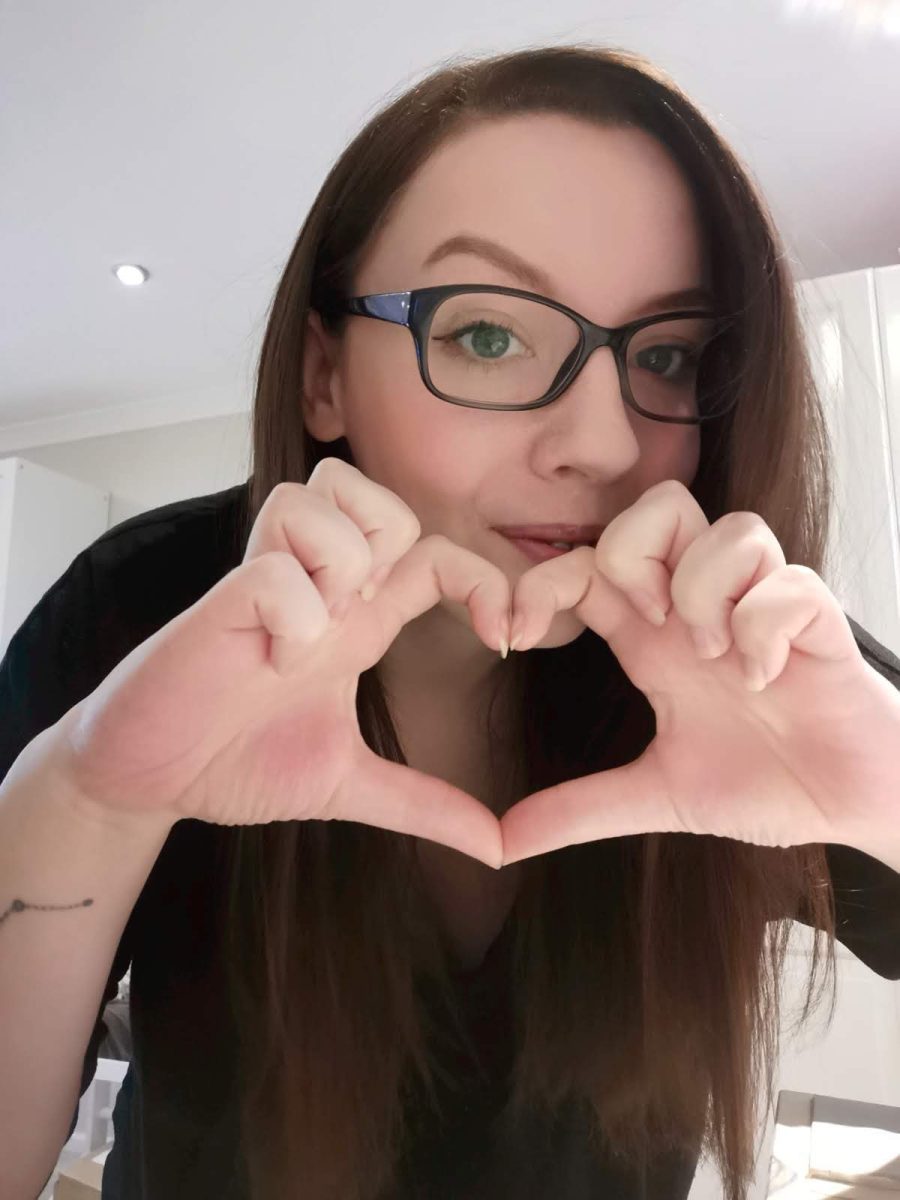 Danielle Wathes holding her hands in a heart shape